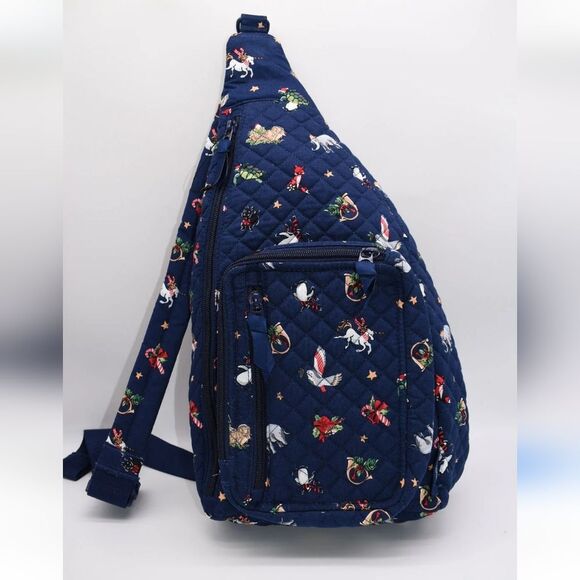 Vera Bradley Handbags - Vera Bradley Navy Blue Quilted Snow Globe Motifs Sling Backpack